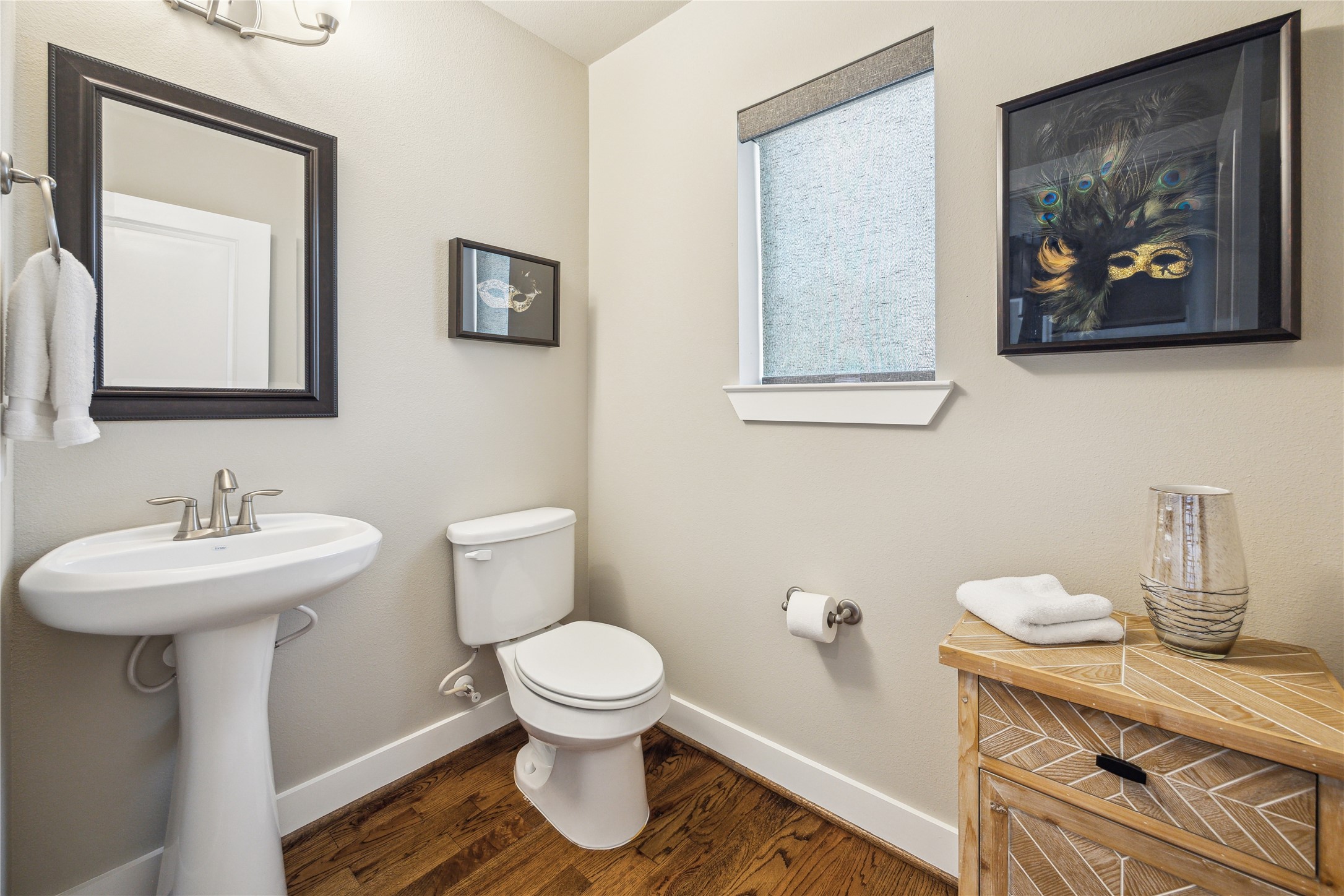 4102 Marina Street Houston, TX 77007 - Photo 12 of 23 a bathroom with a toilet a sink and mirror