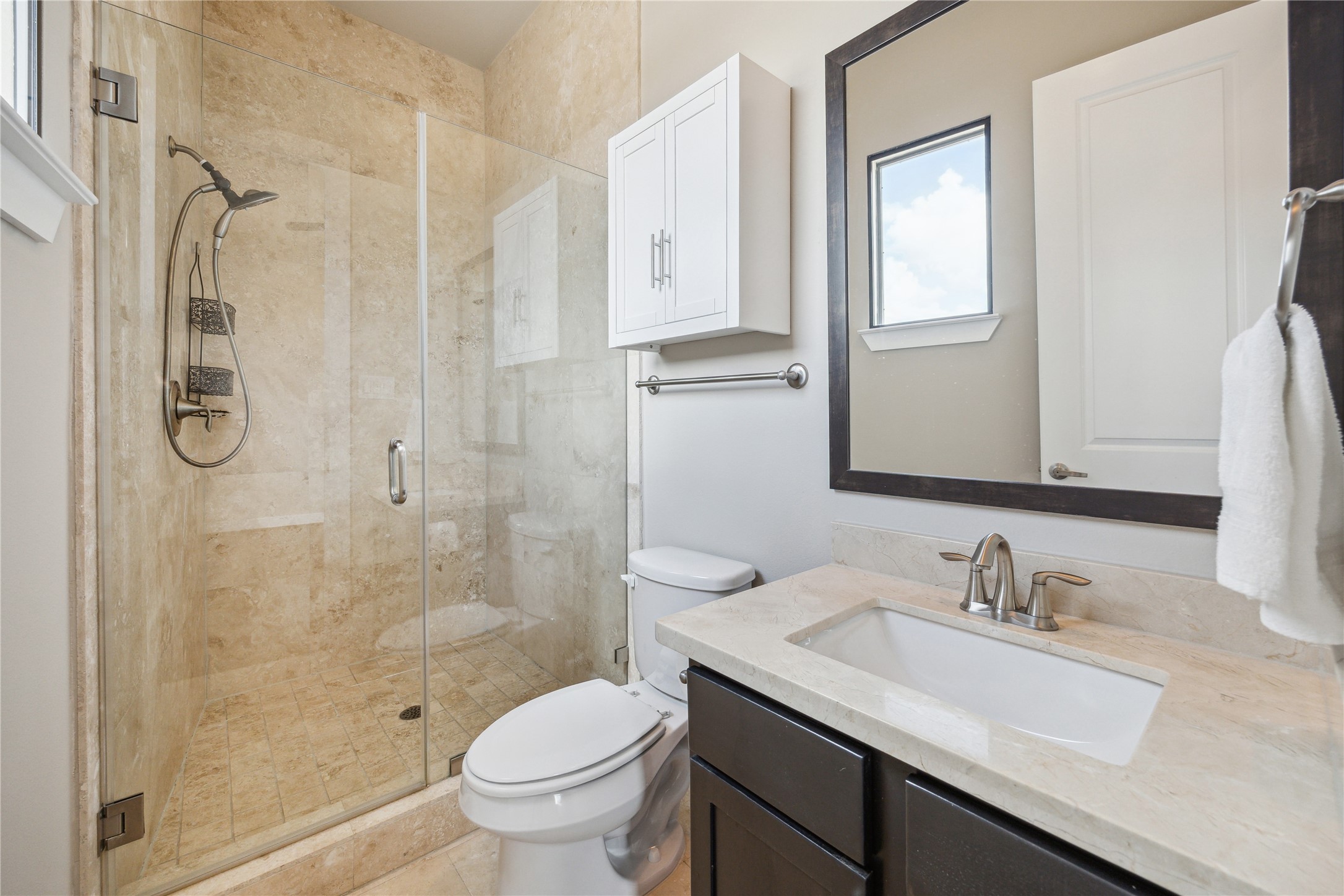 4102 Marina Street Houston, TX 77007 - Photo 17 of 23 a bathroom with a granite countertop sink a toilet and shower