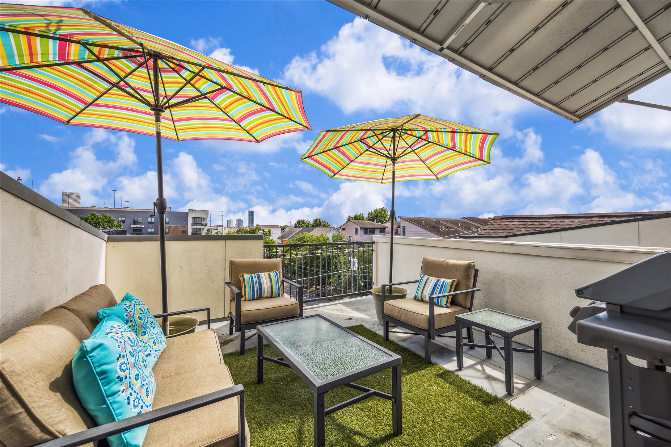 4102 Marina Street Houston, TX 77007 - Photo 18 of 23 a view of an outdoor sitting area with couch and umbrella
