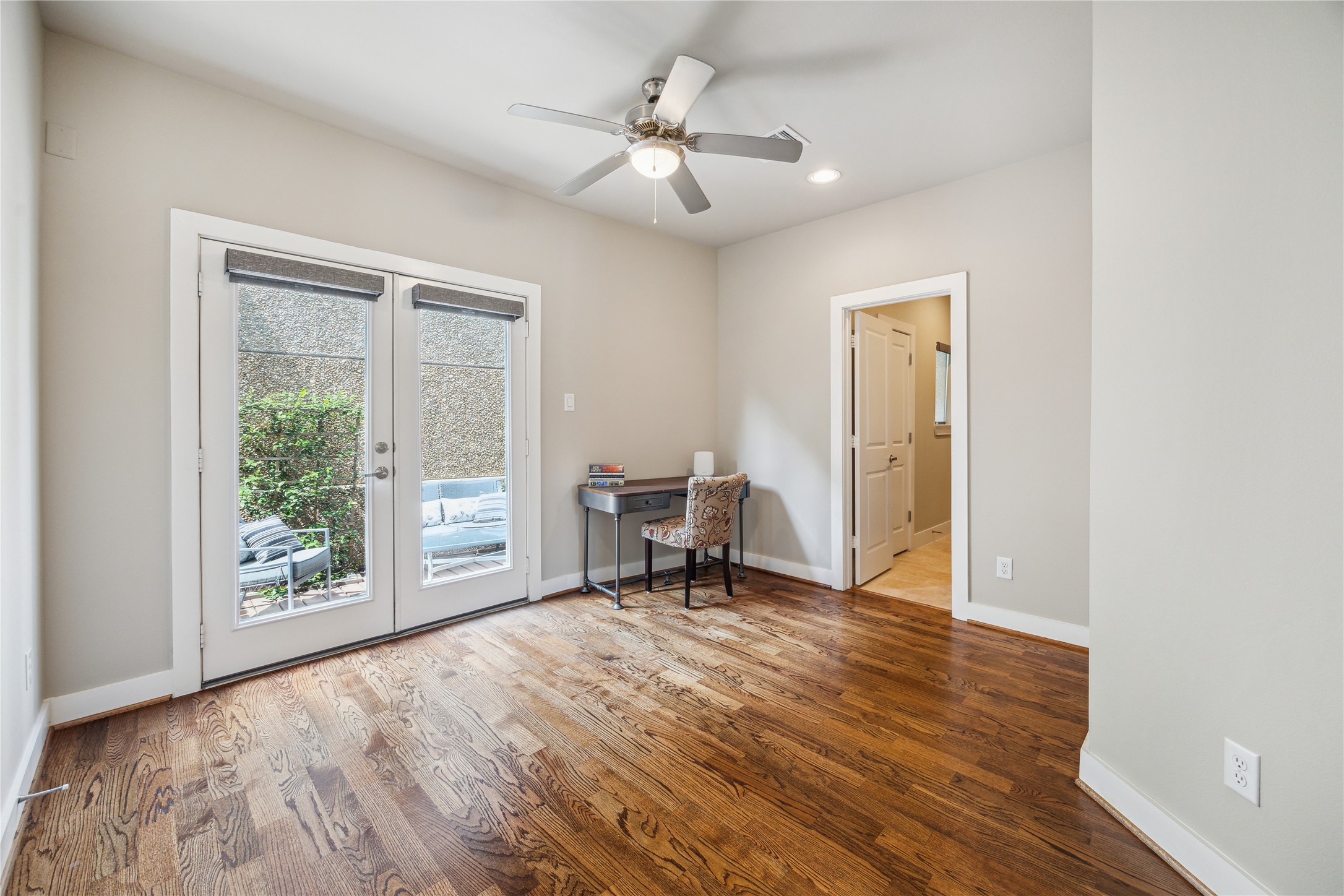 4102 Marina Street Houston, TX 77007 - Photo 3 of 23 a view of an empty room with a window and wooden floor