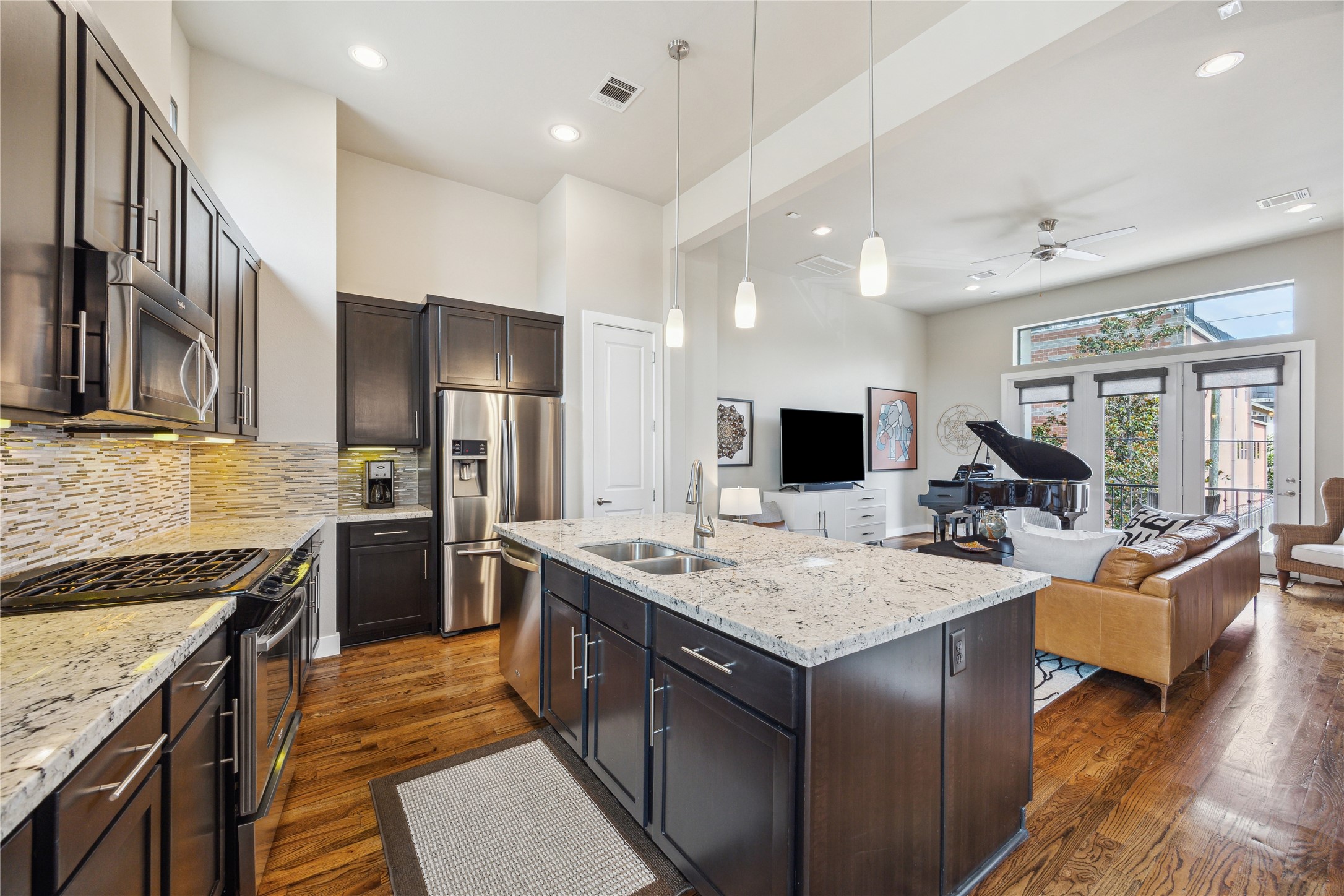 4102 Marina Street Houston, TX 77007 - Photo 9 of 23 a open kitchen with stainless steel appliances granite countertop a sink stove and refrigerator