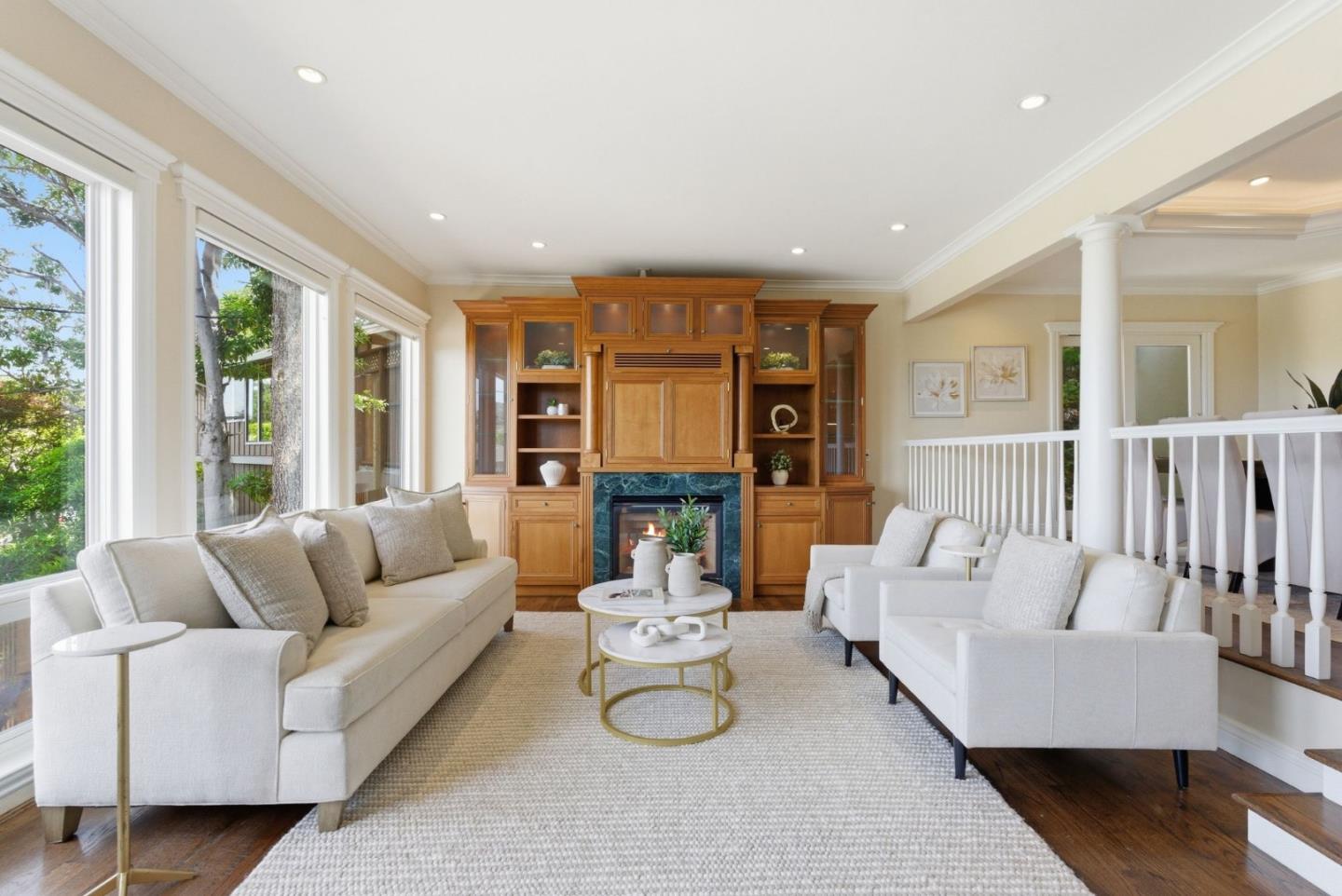2884 Roland Avenue San Carlos, CA 94070 - Photo 11 of 27 a living room with fireplace furniture and floor to ceiling windows