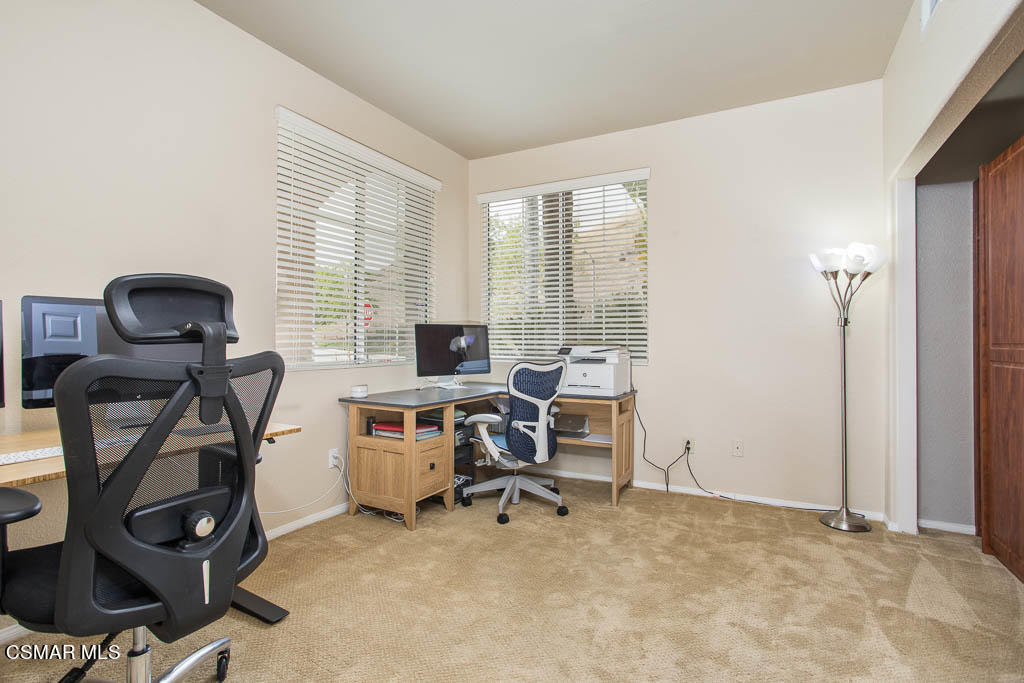 1902 Winterdew Avenue Simi Valley, CA 93065 - Photo 15 of 29 a view of a workspace with furniture and a window