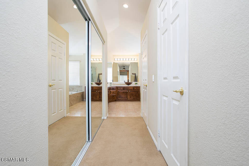 1902 Winterdew Avenue Simi Valley, CA 93065 - Photo 19 of 29 a view of a hallway with a livingroom and a bathroom with sink