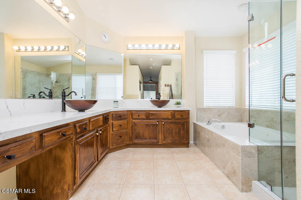 1902 Winterdew Avenue Simi Valley, CA 93065 - Photo 20 of 29 a spacious bathroom with a tub sink and mirror