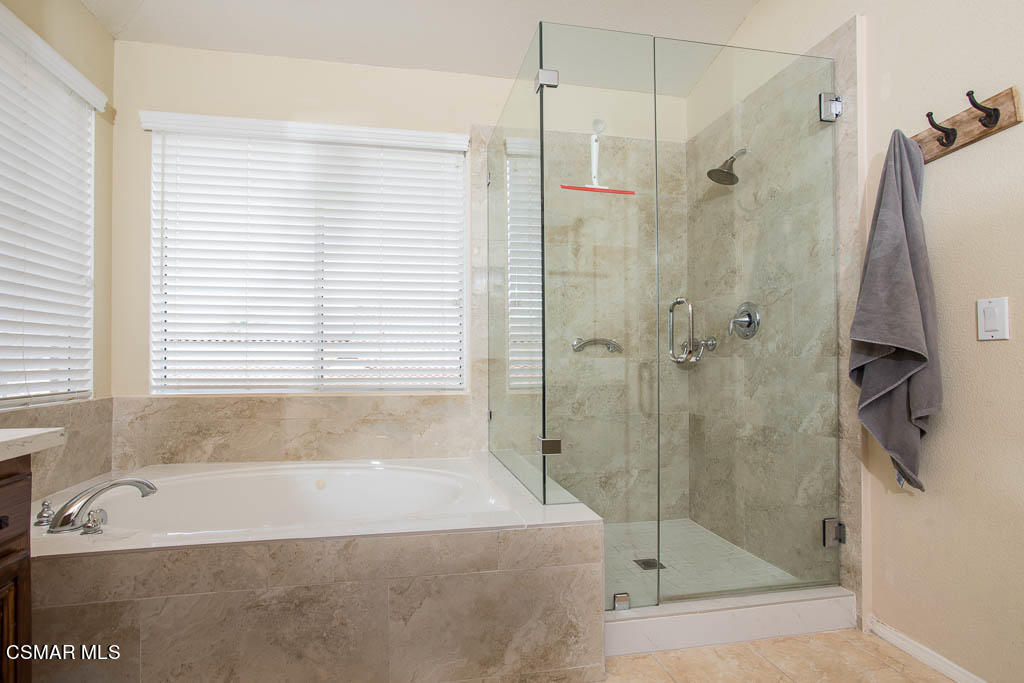 1902 Winterdew Avenue Simi Valley, CA 93065 - Photo 21 of 29 a bathroom with a shower and a bath tub