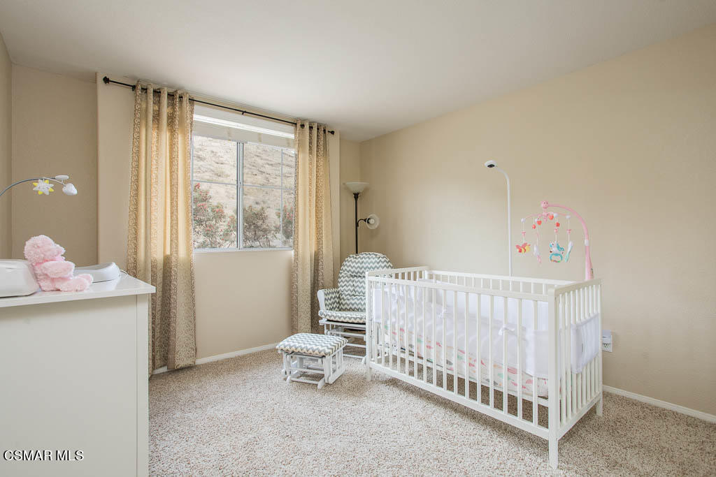 1902 Winterdew Avenue Simi Valley, CA 93065 - Photo 24 of 29 a bedroom with a bed and a window