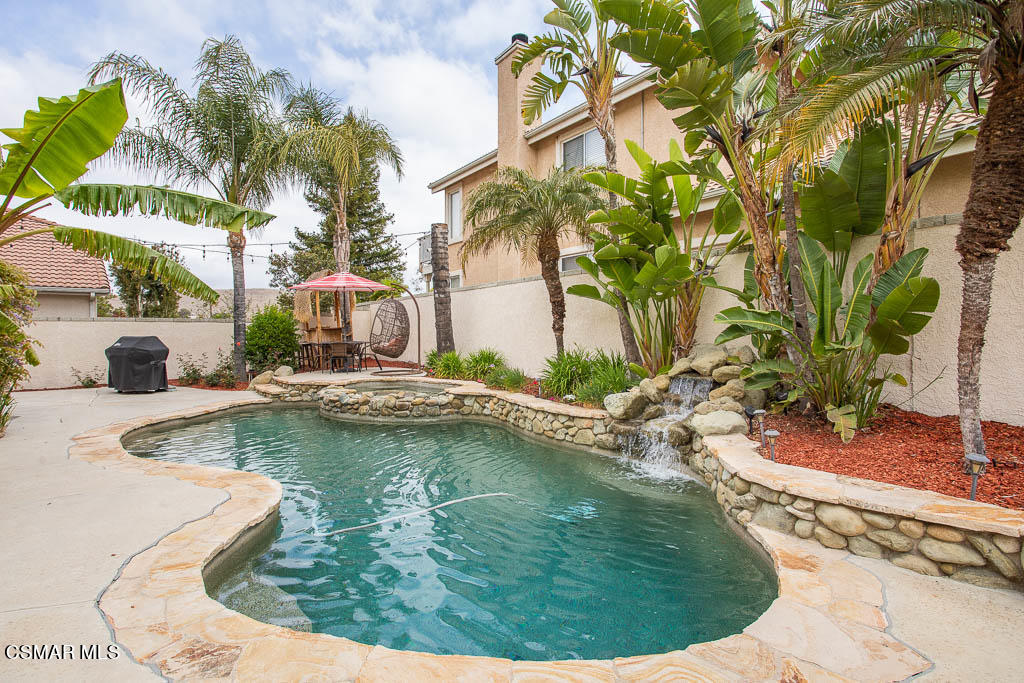 1902 Winterdew Avenue Simi Valley, CA 93065 - Photo 27 of 29 a view of a swimming pool with a sitting space