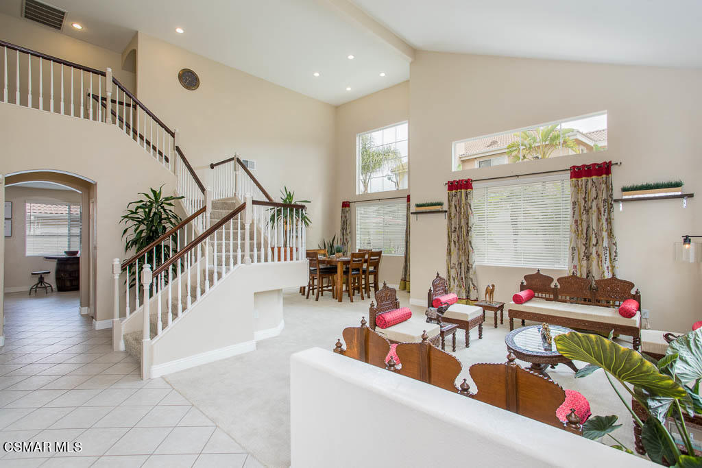 1902 Winterdew Avenue Simi Valley, CA 93065 - Photo 4 of 29 a living room with lots of furniture and a dining table with wooden floor