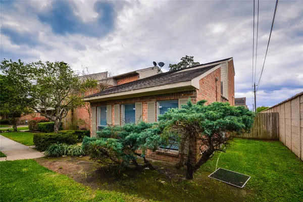 a house view with a garden space