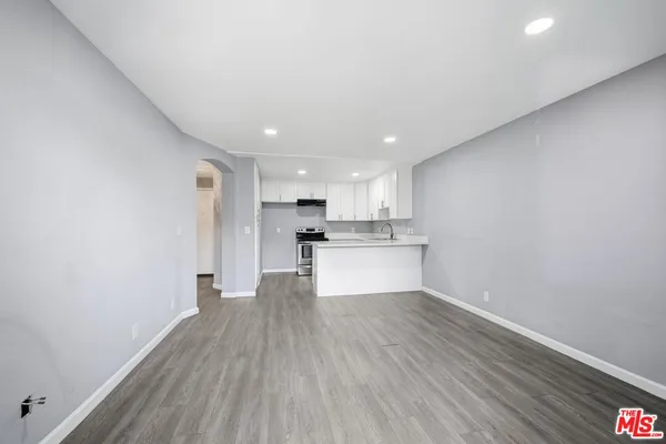 a view of kitchen with wooden floor