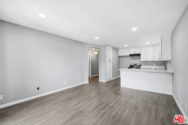 a view of kitchen with wooden floor