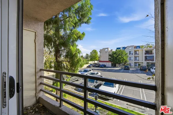 a view of a balcony with an outdoor space