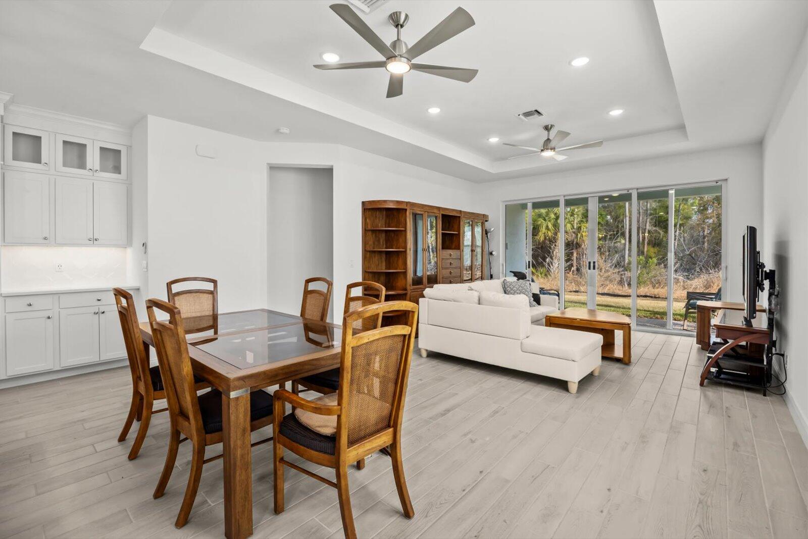 10139 Dreamweaver Road Port St. Lucie, FL 34987 - Photo 11 of 45 Dining Room and Great Room