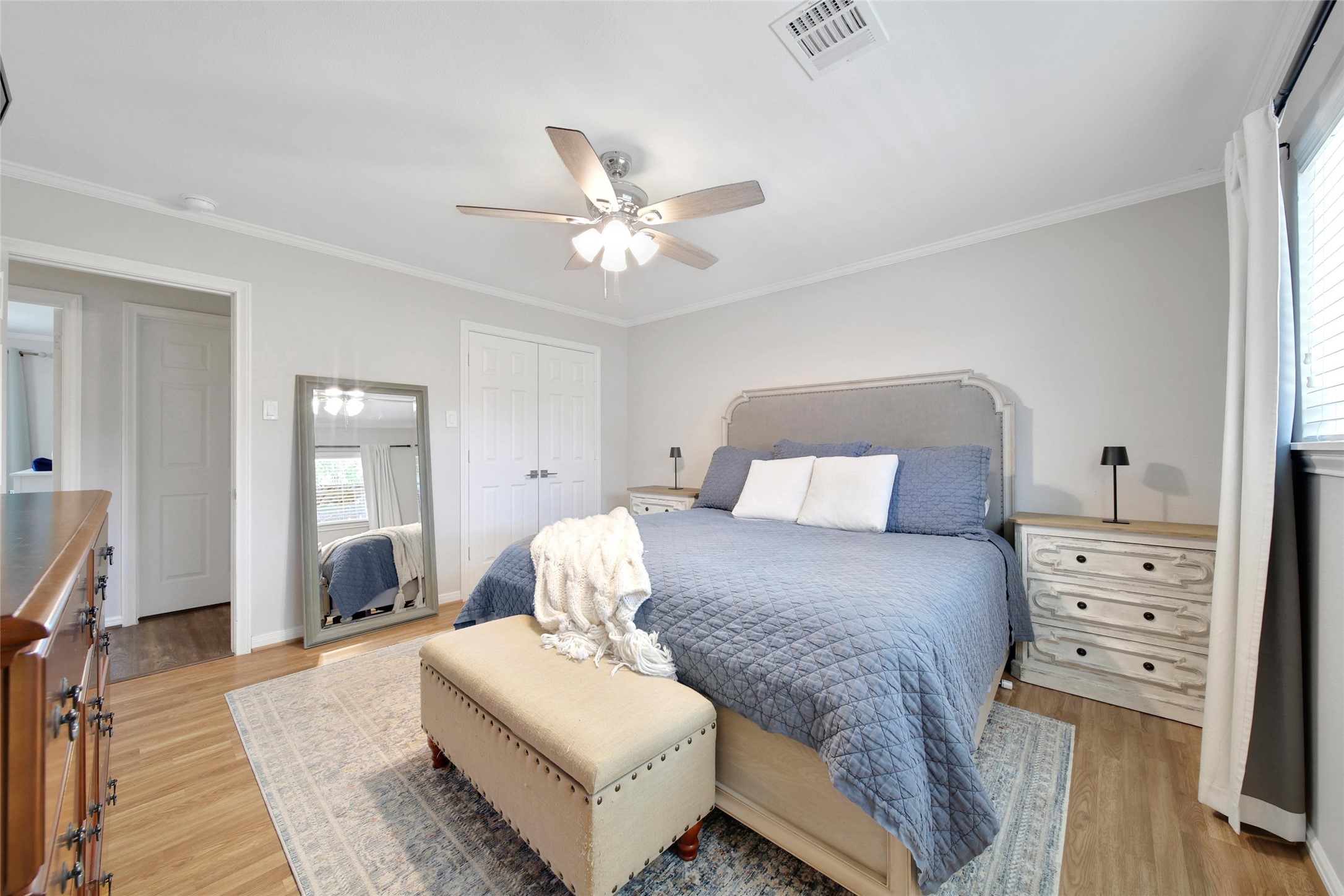 4402 Fallbrook Drive Houston, TX 77018 - Photo 20 of 29 a bedroom with a bed and wooden floor