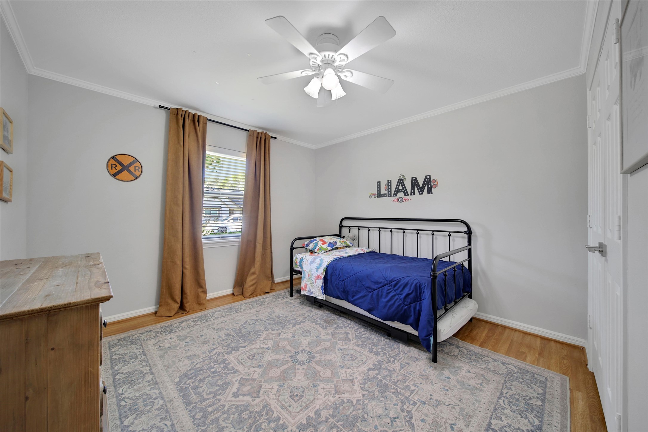 4402 Fallbrook Drive Houston, TX 77018 - Photo 23 of 29 a bed sitting in a bedroom next to a window