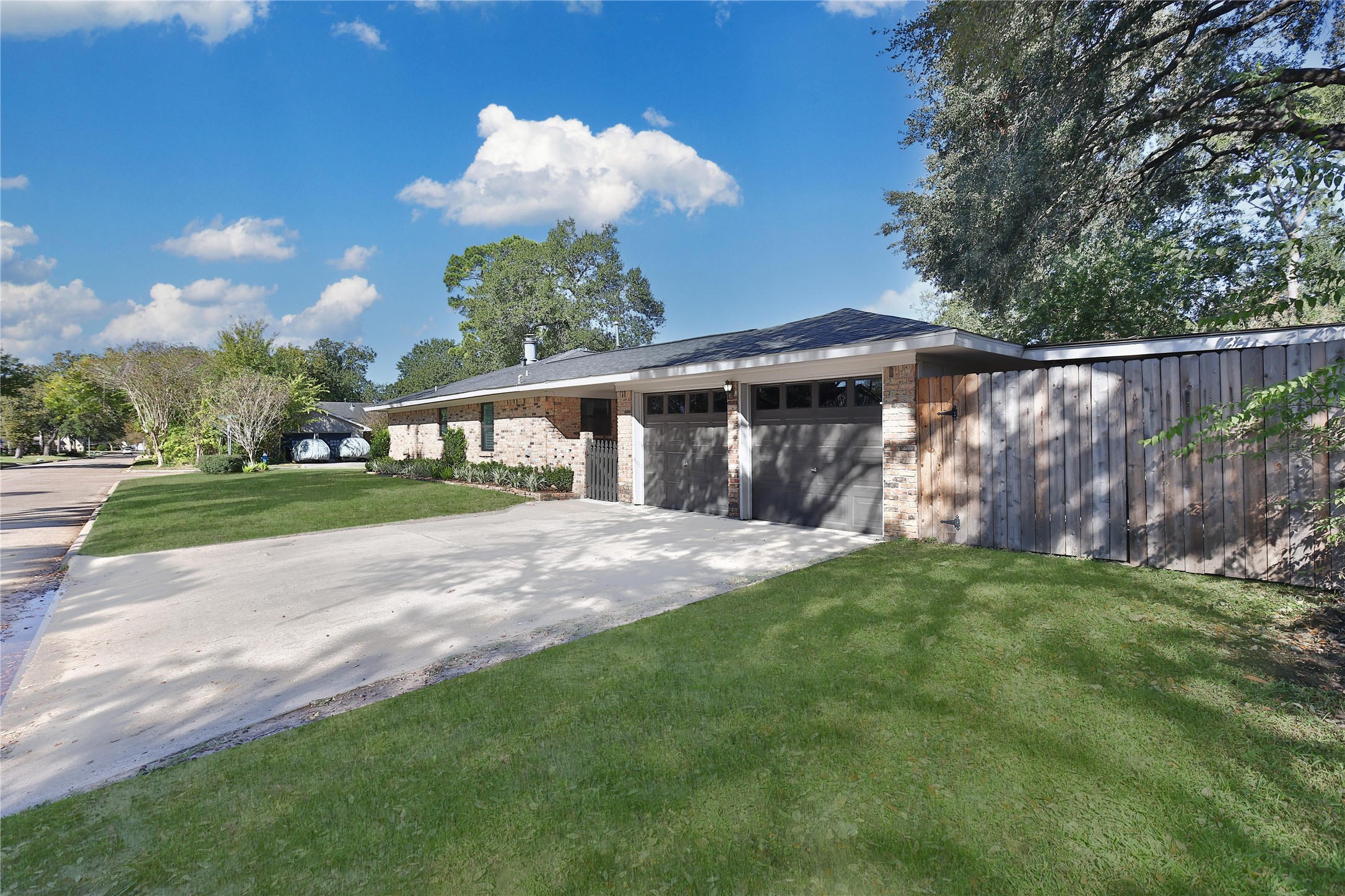 4402 Fallbrook Drive Houston, TX 77018 - Photo 4 of 29 a front view of a house with a garden