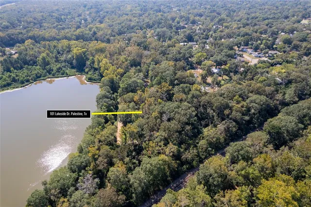 an aerial view of house with yard swimming pool and lake view