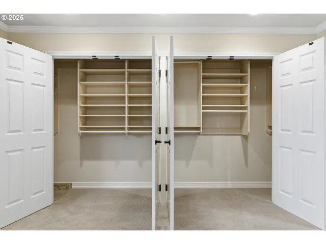 a view of closet area with empty racks