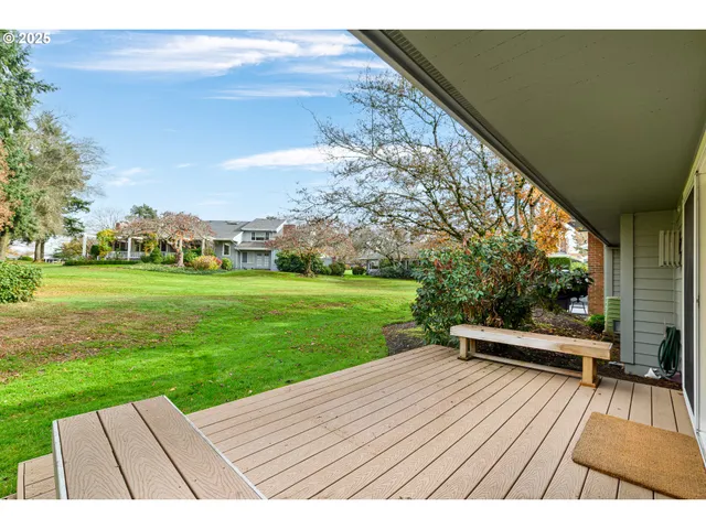 a view of outdoor space with deck and yard