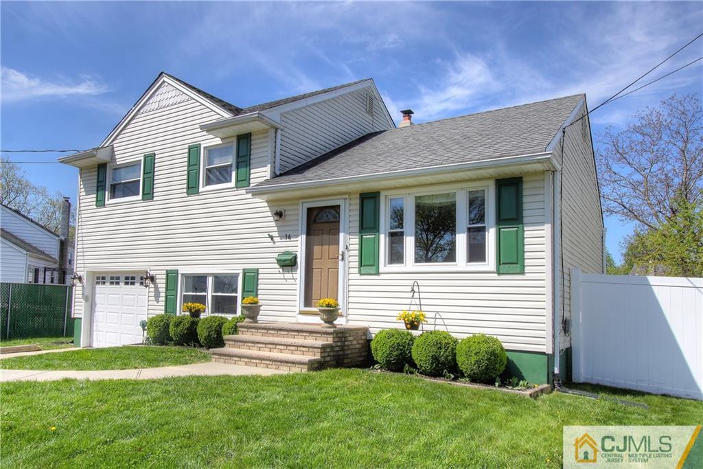 14 Wilshire Road Edison, NJ 08817 - Photo 1 of 22 a front view of a house with a yard