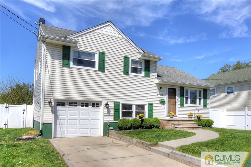 14 Wilshire Road Edison, NJ 08817 - Photo 2 of 22 a front view of a house with a yard and garage