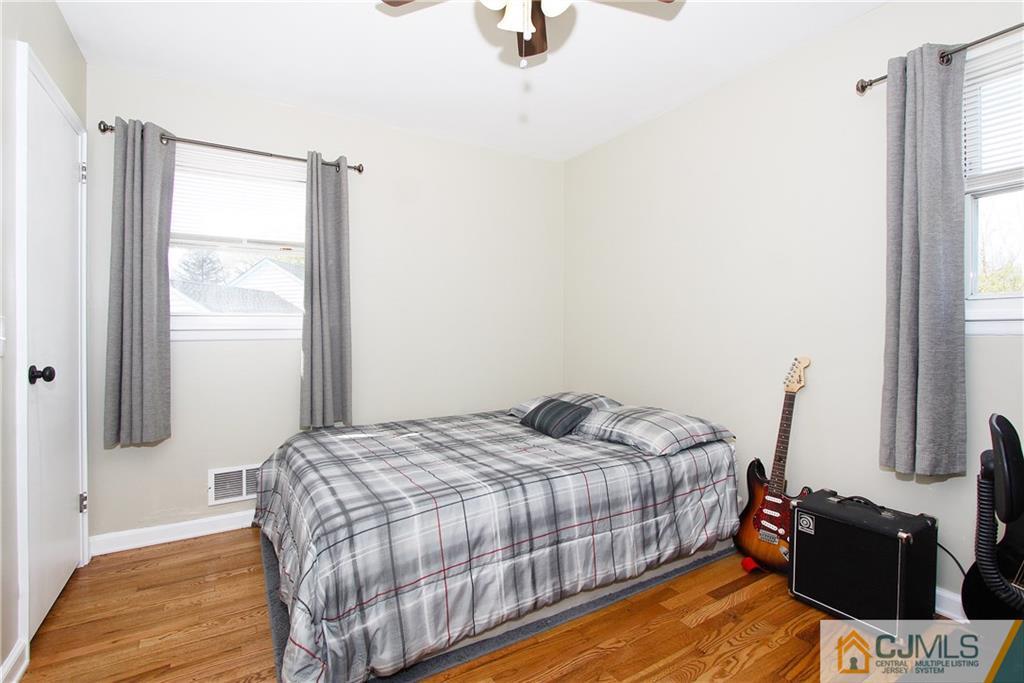 14 Wilshire Road Edison, NJ 08817 - Photo 11 of 22 a bedroom with a bed and wooden floor