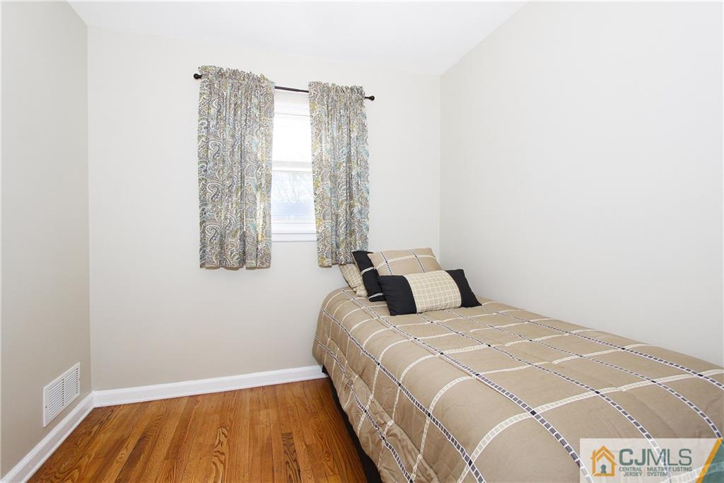 14 Wilshire Road Edison, NJ 08817 - Photo 12 of 22 a bedroom with a bed and a window