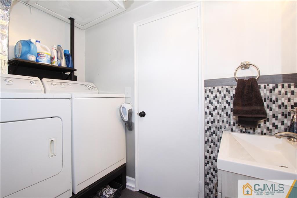 14 Wilshire Road Edison, NJ 08817 - Photo 16 of 22 a bathroom with a sink and a mirror