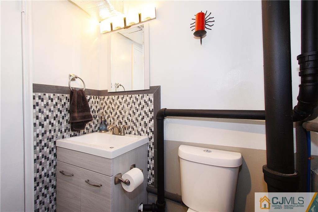 14 Wilshire Road Edison, NJ 08817 - Photo 17 of 22 a bathroom with a sink toilet and shower