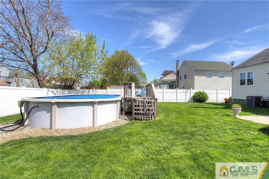 14 Wilshire Road Edison, NJ 08817 - Photo 20 of 22 a view of backyard with a garden and deck