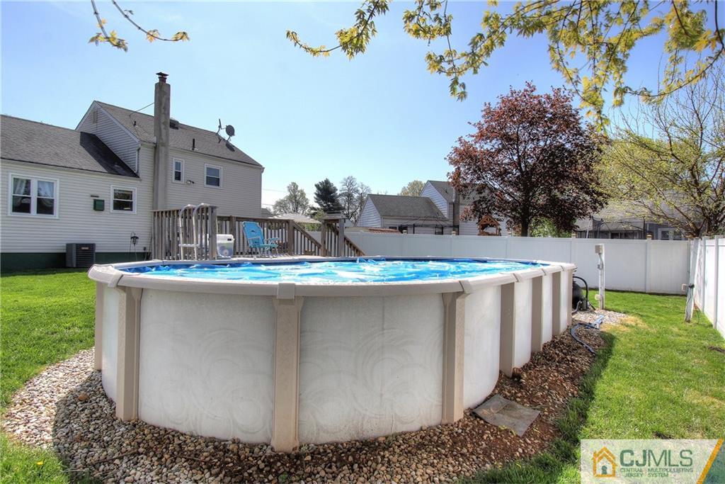 14 Wilshire Road Edison, NJ 08817 - Photo 21 of 22 a view of a house with a yard and sitting area