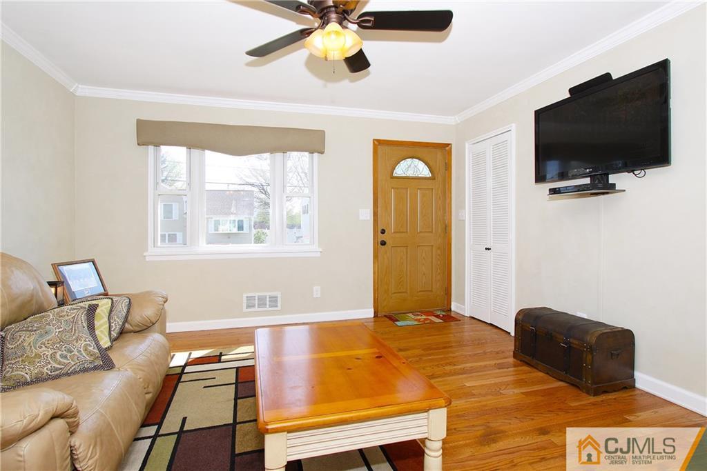 14 Wilshire Road Edison, NJ 08817 - Photo 4 of 22 a living room with couch and a flat screen tv