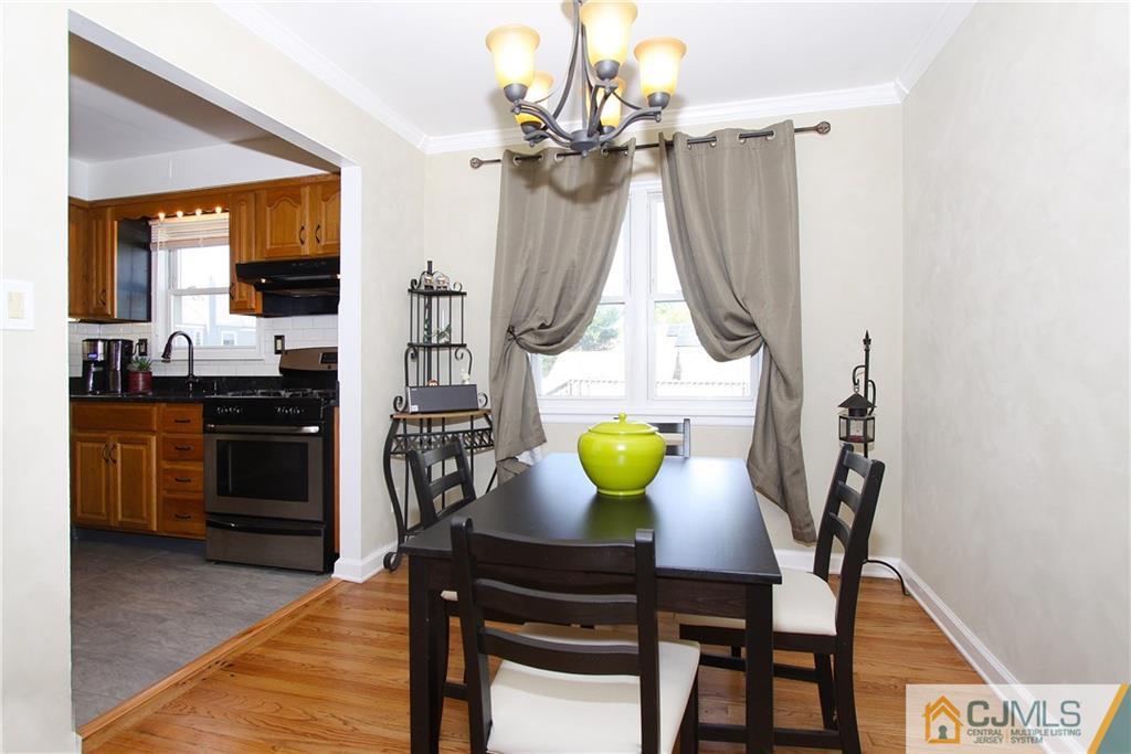 14 Wilshire Road Edison, NJ 08817 - Photo 6 of 22 a view of a dining room with furniture and a chandelier