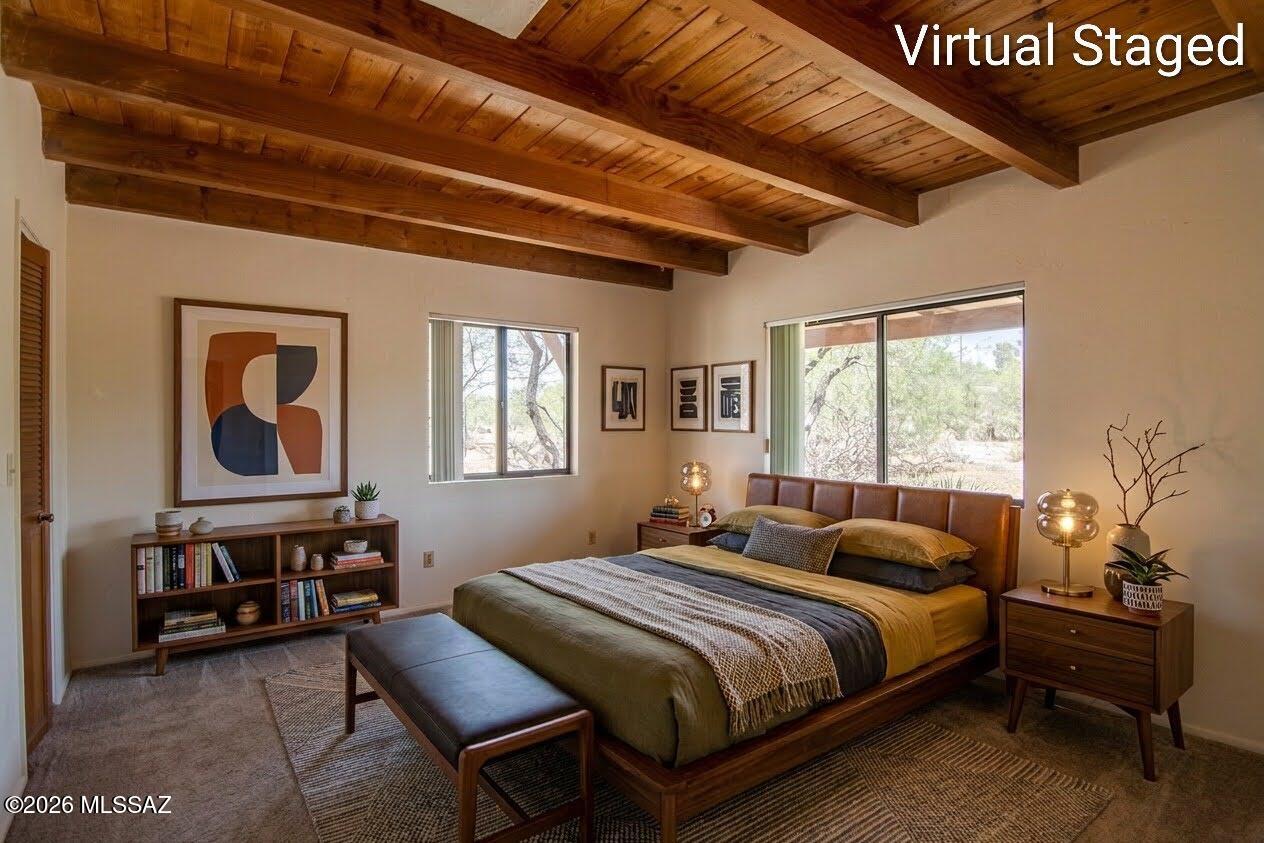4130 East River Road Tucson, AZ 85718 - Photo 38 of 46 a bedroom with a bed a dresser next to a window