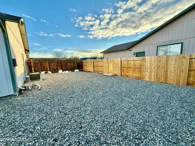 a view of a backyard of the house