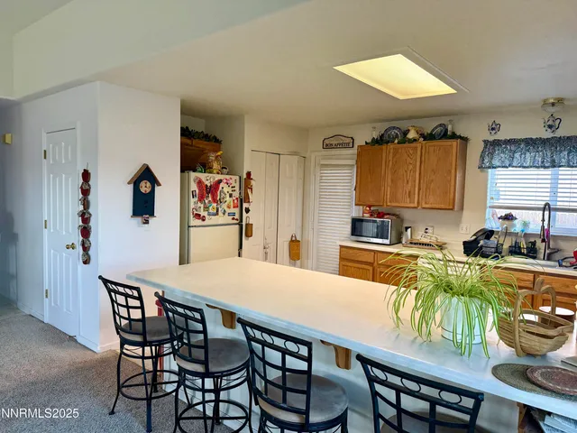 a kitchen with a table and chairs in it