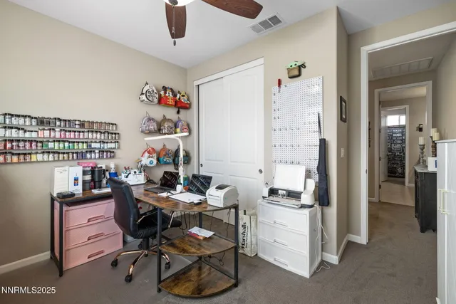 a bedroom with bed and a chandelier