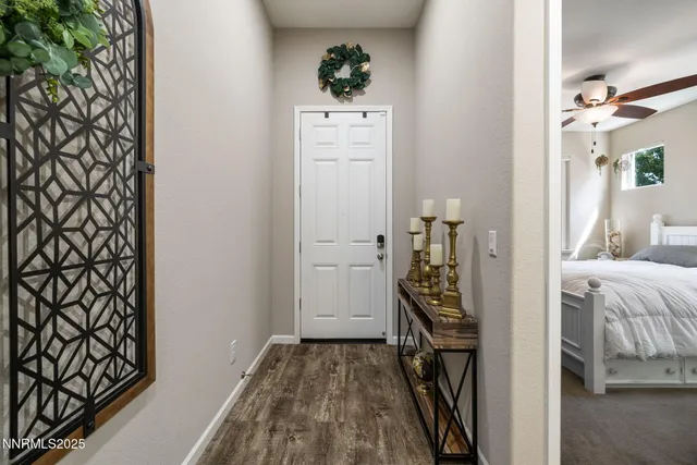 a view of a hallway with wooden floor and bedroom view