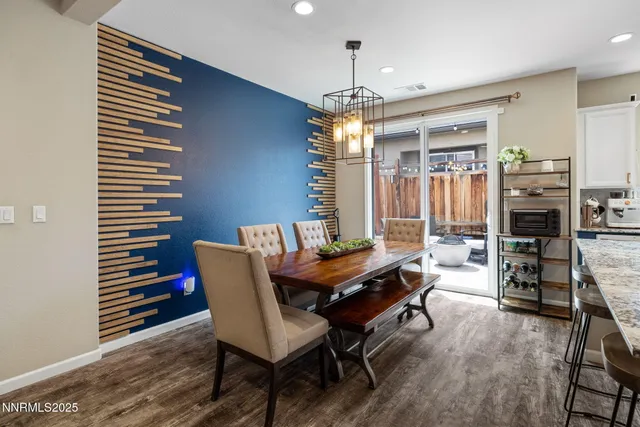 a dining room with furniture and chandelier