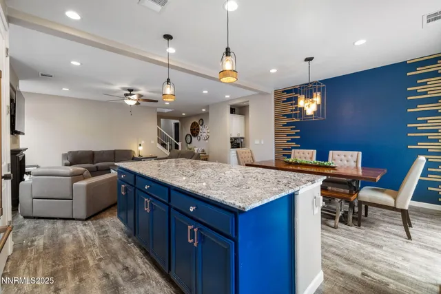 a large kitchen with a table and chairs