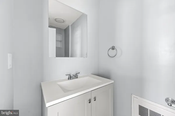 a bathroom with a sink and mirror