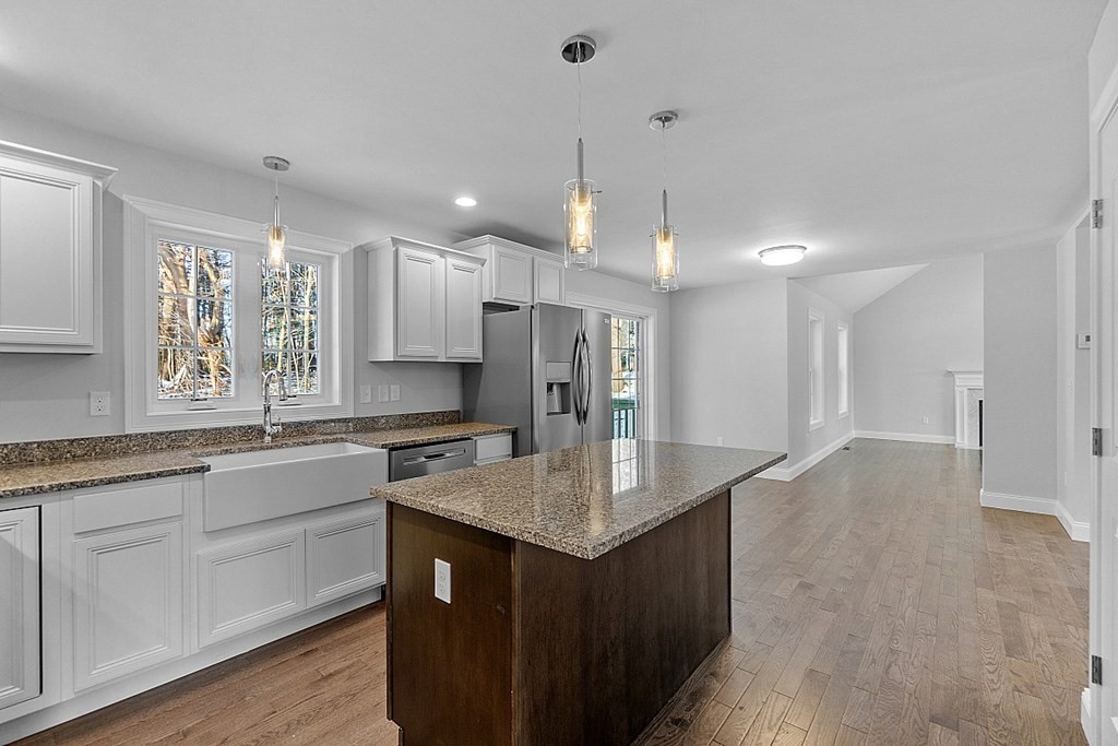 144 French Road, Unit LOT 3 Templeton, MA 01468 - Photo 12 of 40 a kitchen with stainless steel appliances granite countertop a sink stove and refrigerator