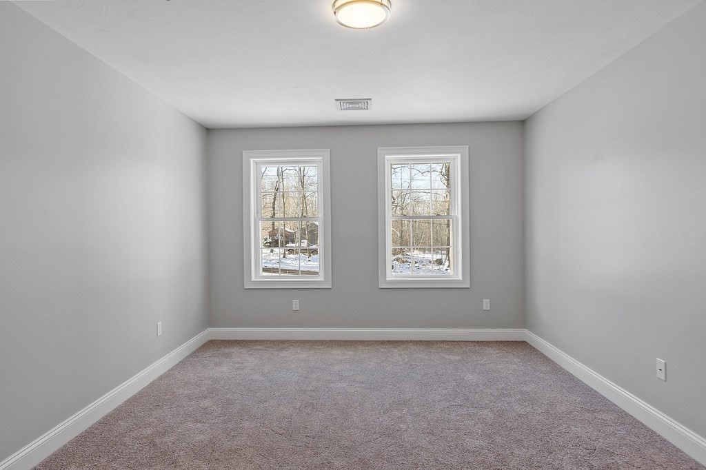 144 French Road, Unit LOT 3 Templeton, MA 01468 - Photo 28 of 40 an empty room with windows