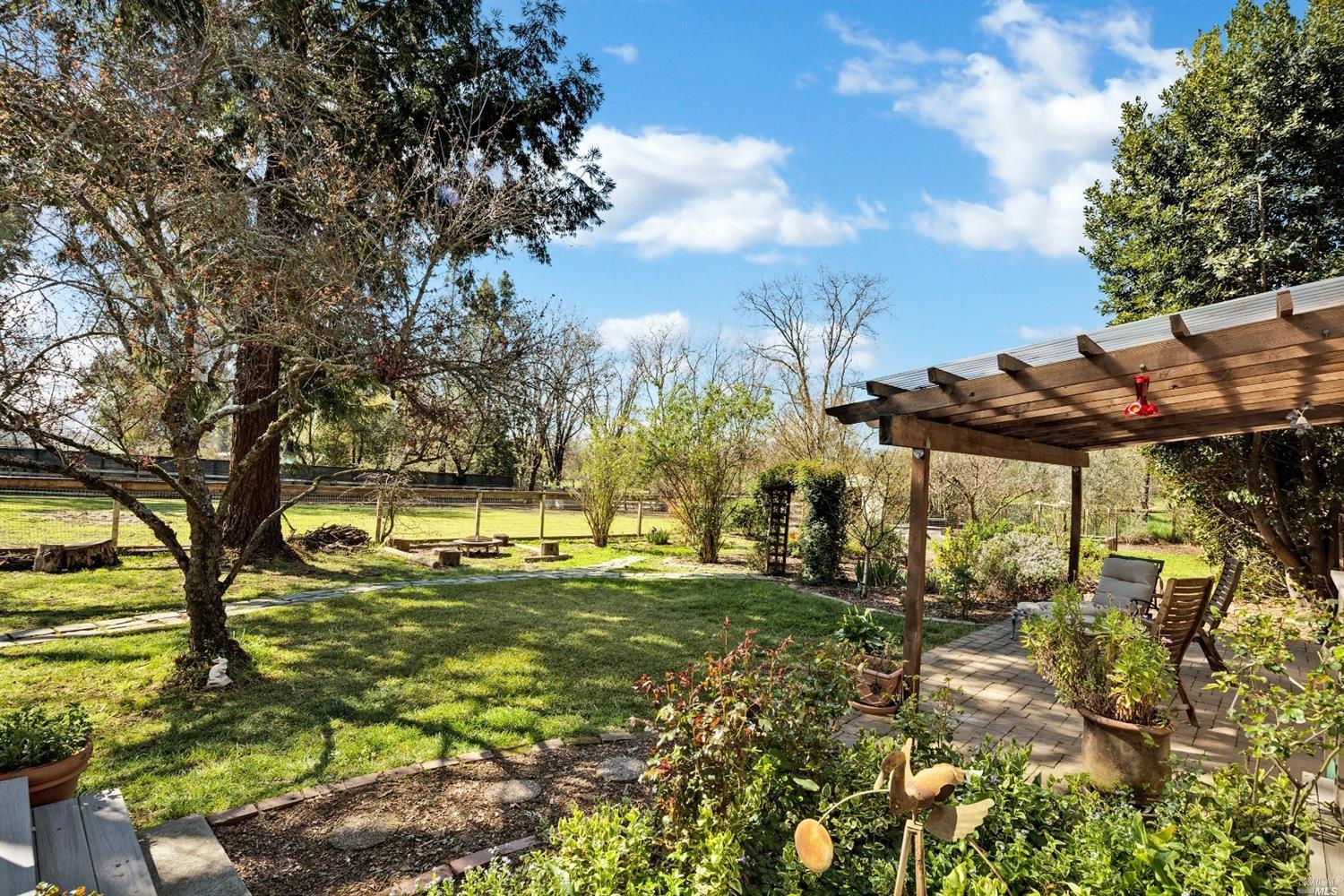 a view of a yard with an outdoor space