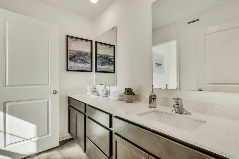 2433 Semillon Street Oswego, IL 60543 - Photo 19 of 27 a bathroom with a sink and a mirror