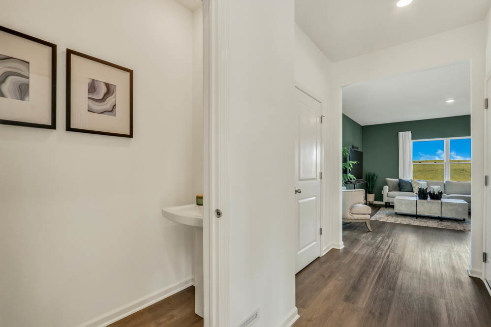 2433 Semillon Street Oswego, IL 60543 - Photo 2 of 27 a view of a hallway with wooden floor and furniture
