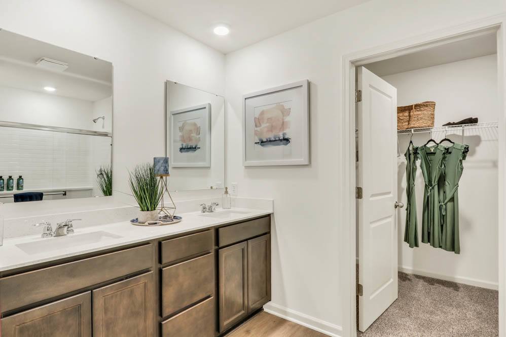 2433 Semillon Street Oswego, IL 60543 - Photo 25 of 27 a bathroom with a double vanity sink and a mirror
