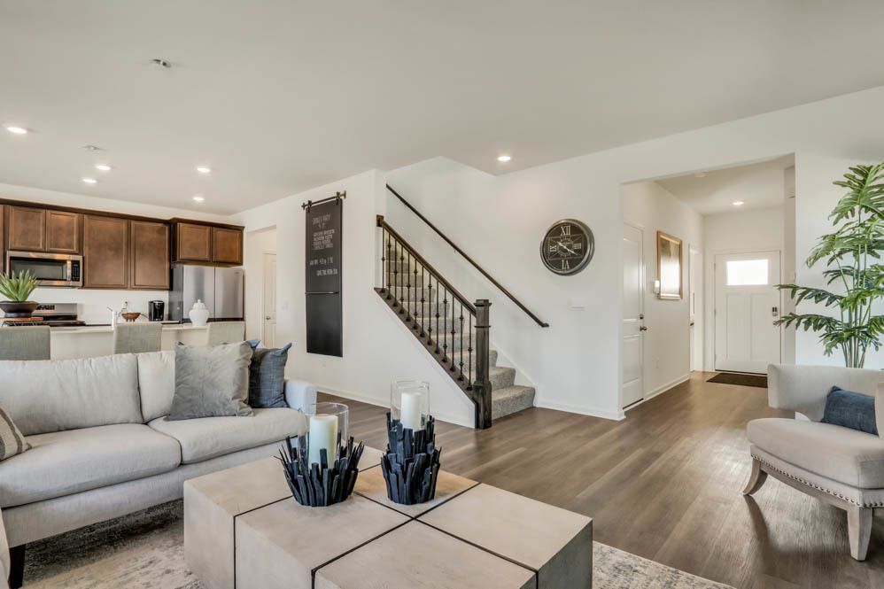 2433 Semillon Street Oswego, IL 60543 - Photo 6 of 27 a living room with furniture and wooden floor