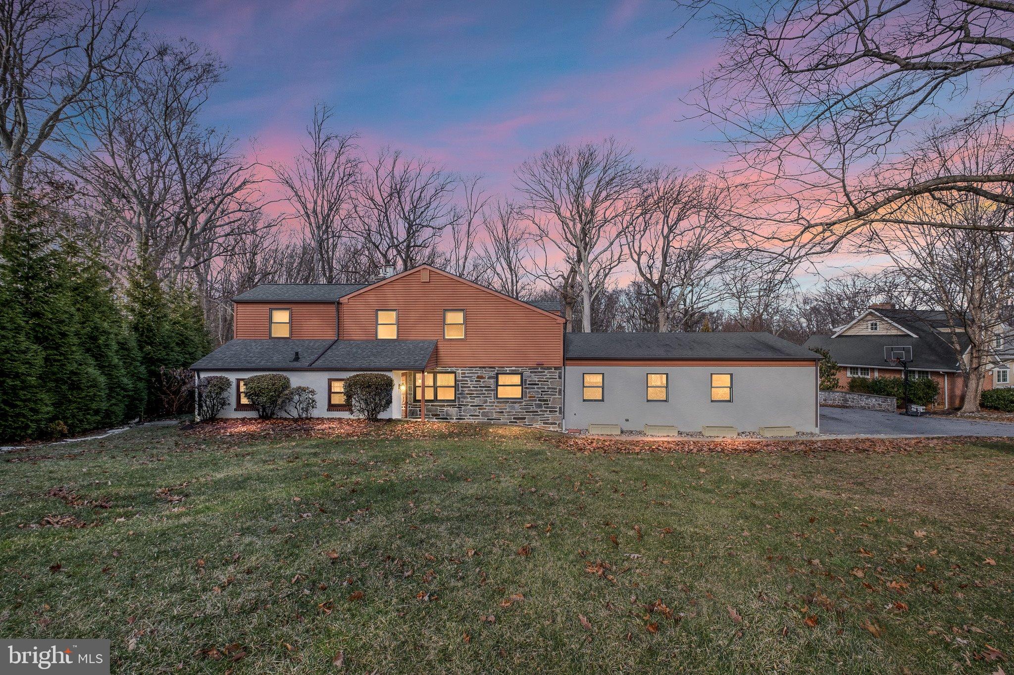 370 Marple Road Broomall, PA 19008 - Photo 1 of 46 a front view of a house with a garden and trees